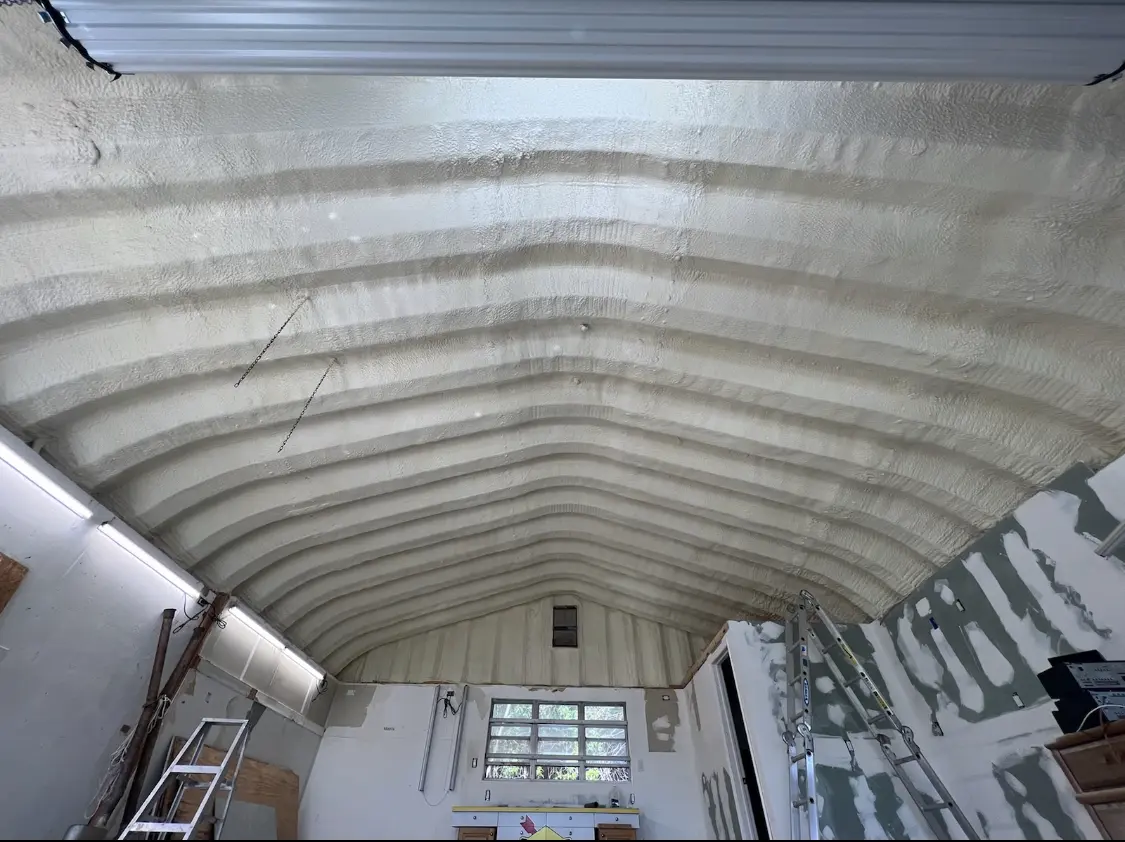 Spray polyurethane foam applied to the underside of a metal roof deck in Walker Mill